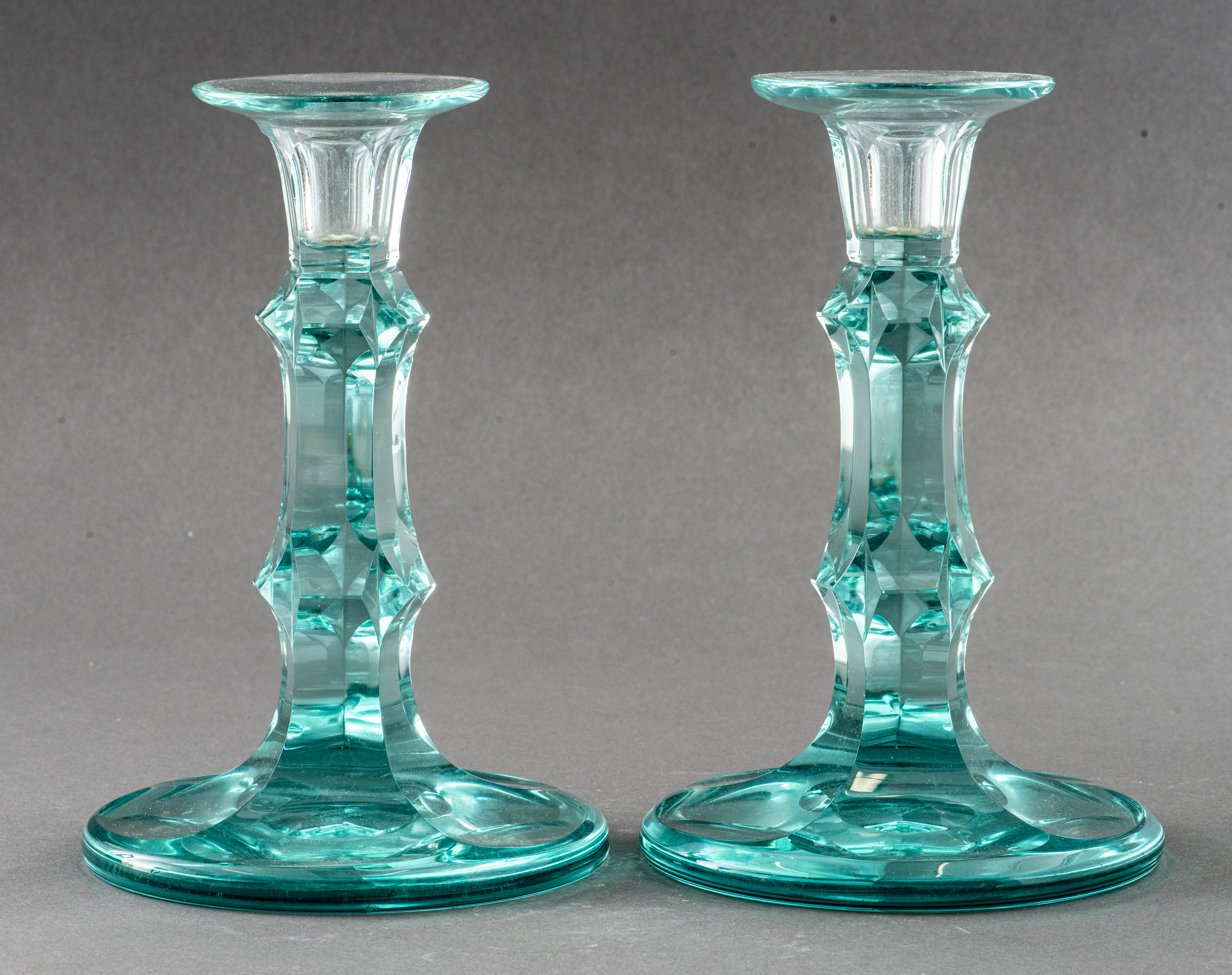 Appraisal: MOSER CZECH GLASS CANDLESTICKS PAIR Pair of Moser Czech blue