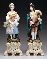 Appraisal: PAIR OF STAFFORDSHIRE FIGURES One depicts a young woman standing