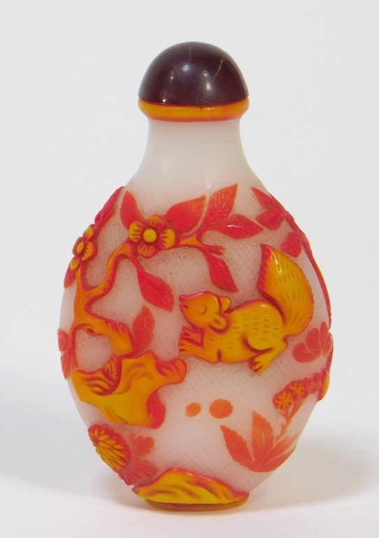 Appraisal: CHINESE CARVED PEKING GLASS SQUIRREL SNUFF BOTTLE China th CenturyThree