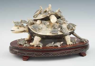 Appraisal: A Carved Ivory Bone Turtle Family Grouping The central figure