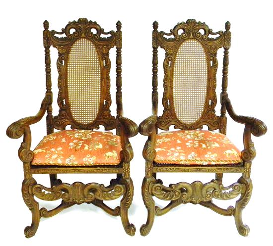 Appraisal: Pair of Baroque Revival throne arm chairs elaborately carved acorn