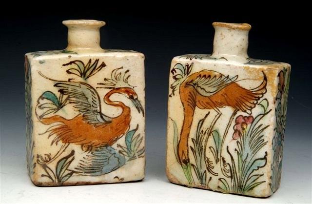 Appraisal: A PAIR OF ISLAMIC POLYCHROME POTTERY SQUARE BOTTLES with stylised