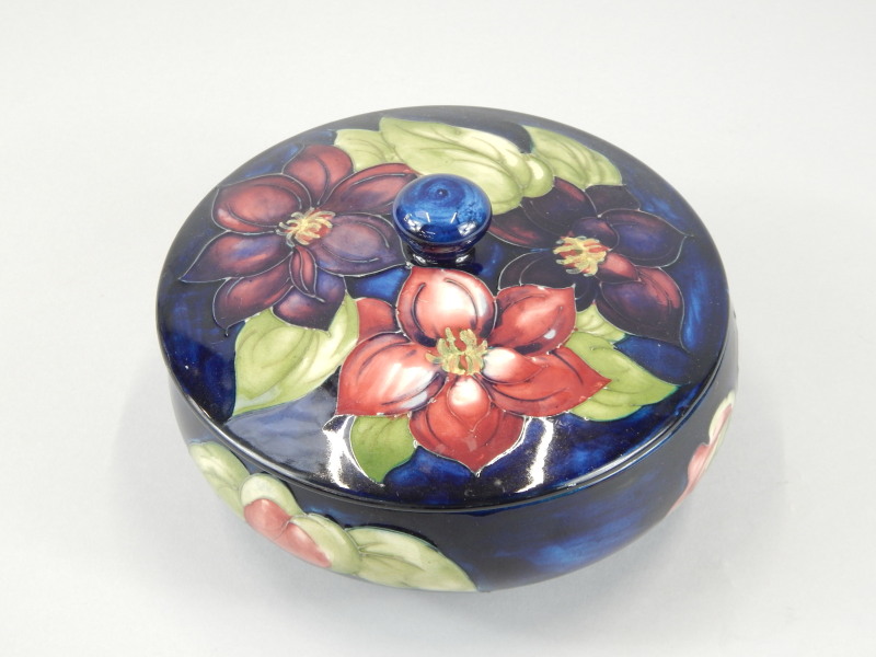 Appraisal: A Moorcroft pottery jar and cover the top decorated with