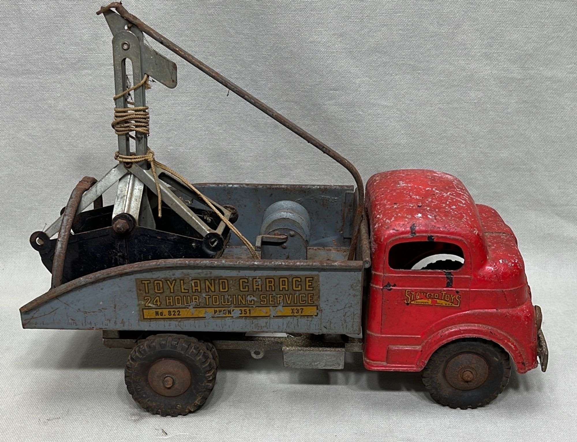 Appraisal: Structo Toyland Garage pressed steel tow truck toyearly-mid th century