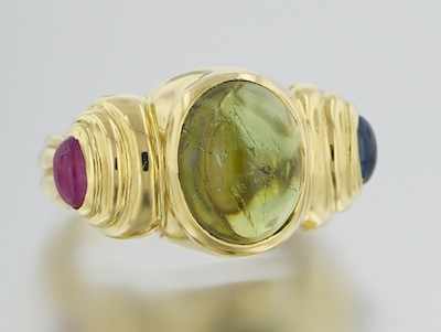 Appraisal: An k Gold Peridot Sapphire and Ruby Ring k yellow