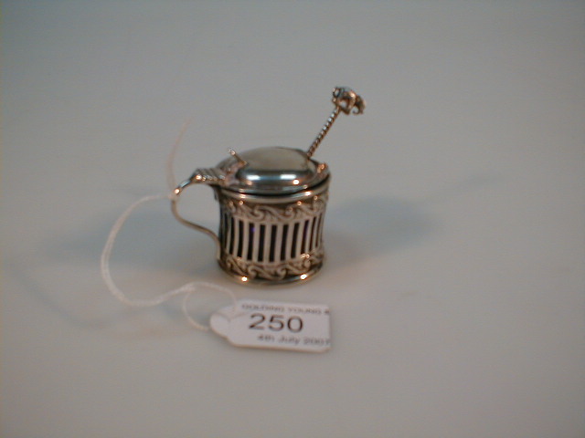 Appraisal: An Edwardian silver drum mustard with pierced body and blue