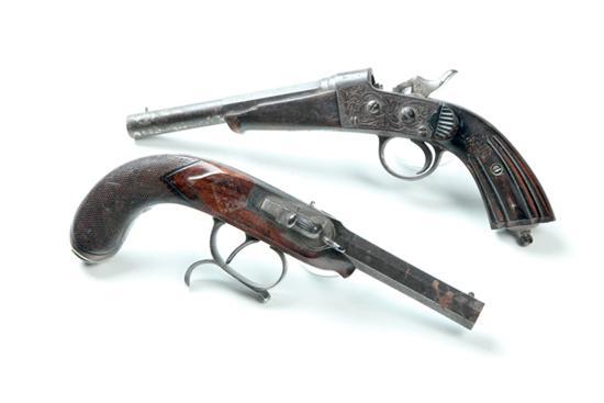 Appraisal: TWO ENGRAVED SINGLE SHOT PISTOLS European th century One has