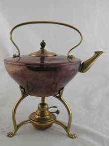 Appraisal: An Arts and Crafts copper and brass kettle on stand