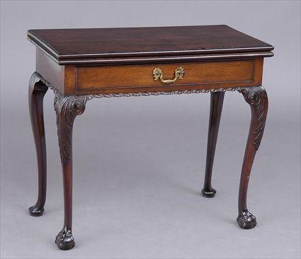 Appraisal: GEORGE III CARVED MAHOGANY GAMES TABLE The rectangular folding top