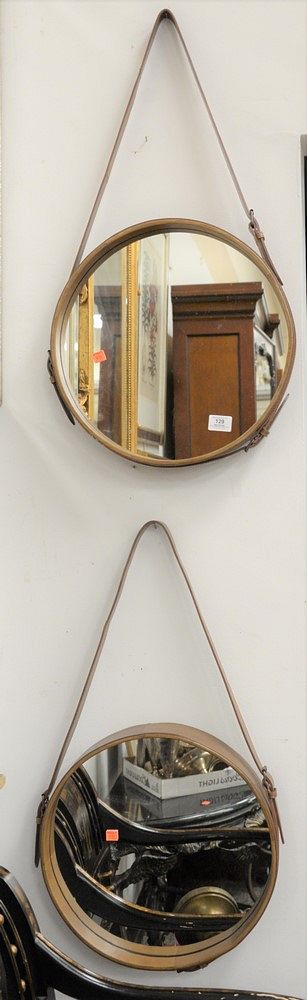 Appraisal: Pair of Jamie Young Company Canteen Style Hanging Round Mirrors