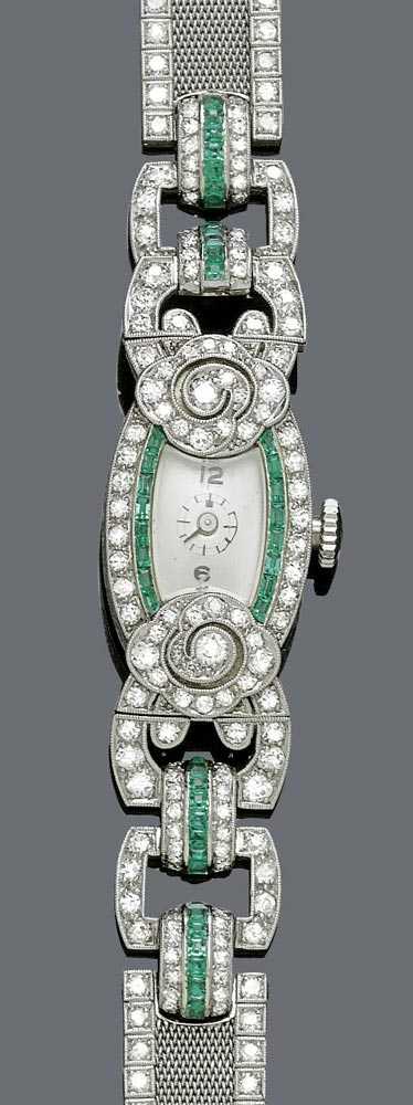 Appraisal: DIAMOND AND EMERALD LADY'S WRISTWATCH ca Platinum Tonneau-shaped case with