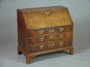 Appraisal: A oak slope front bureau mid th century with fitted