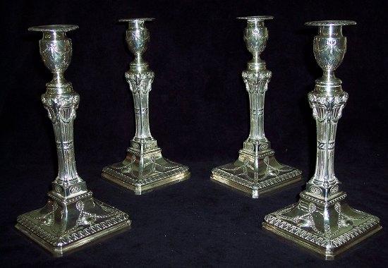 Appraisal: Four late Victorian table candlesticks the bell shaped sconces with