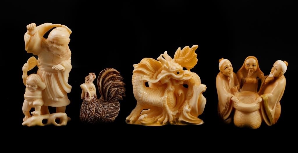 Appraisal: Four carved Japanese netsukes including a dragon two figural groups