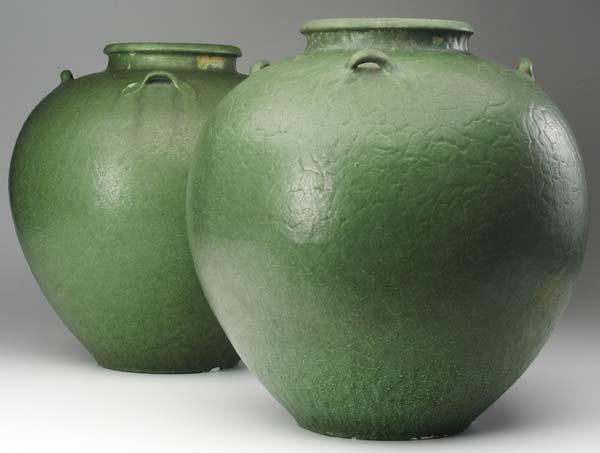 Appraisal: GRUEBY Pair of massive four-handled bulbous vases by Wilhelmina Post