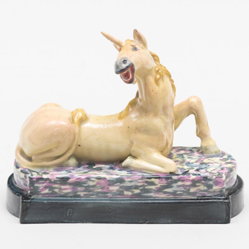 Appraisal: Staffordshire Pottery Figure of a Recumbent Unicorn Unmarked x x