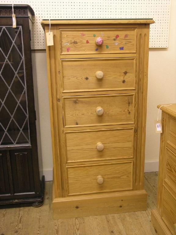 Appraisal: A modern waxed pine chest of five short drawers each