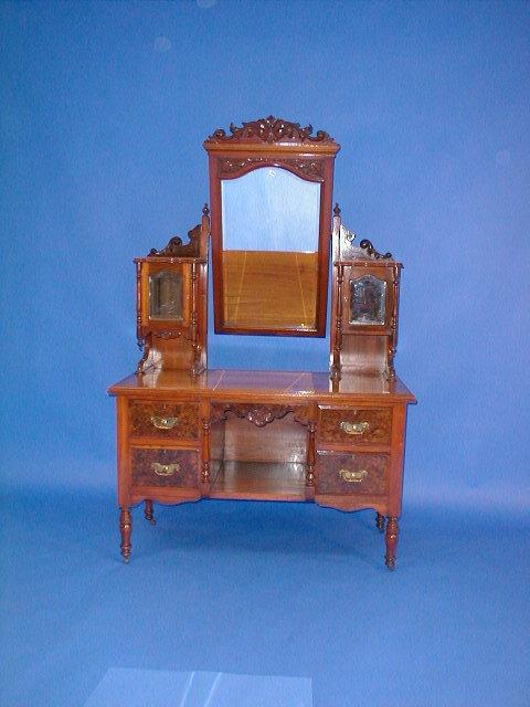 Appraisal: A late Victorian walnut and burr veneered wardrobe with panelled