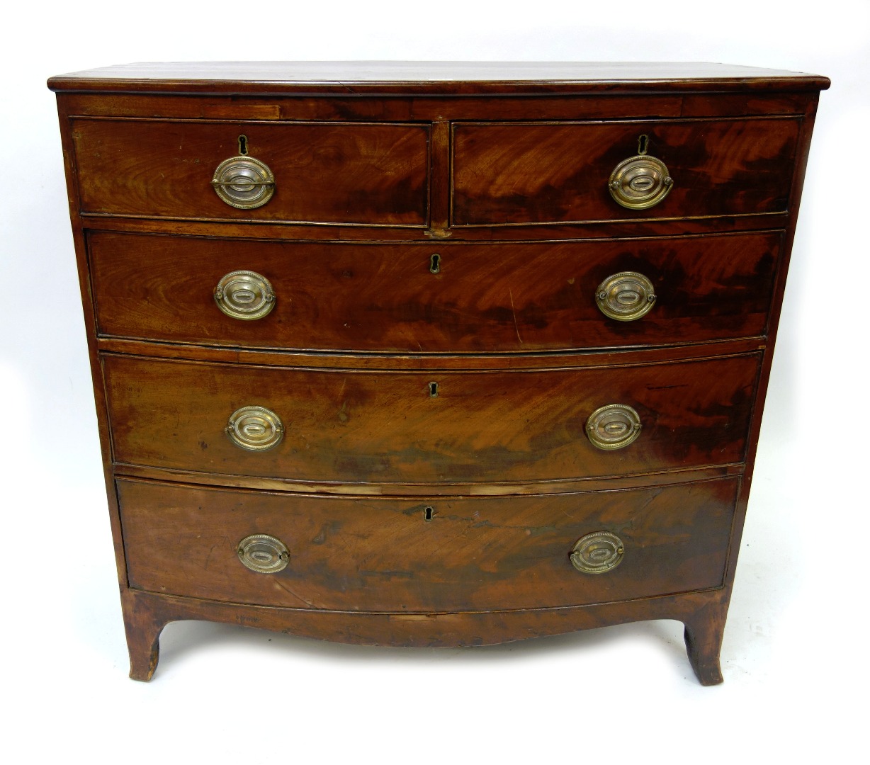 Appraisal: A George III mahogany bowfront chest fitted with two short