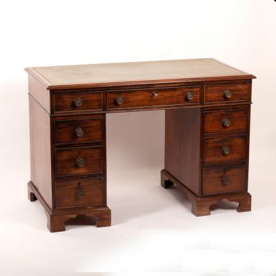 Appraisal: A mahogany pedestal desk the green leather inset writing surface