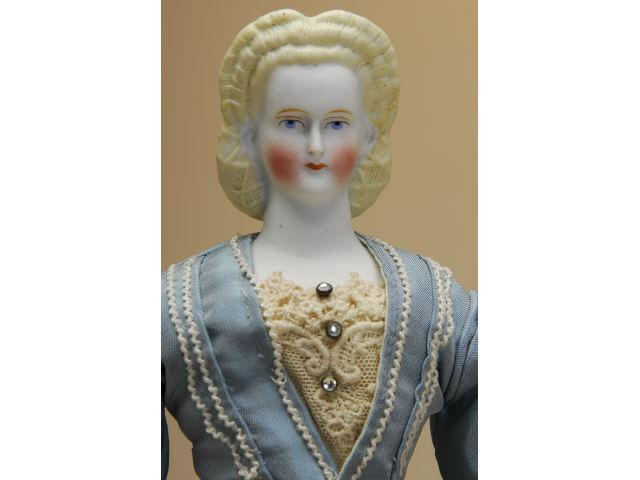 Appraisal: Parian Lady with Snood Germany ca untinted bisque shoulder head