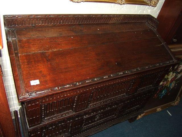 Appraisal: An antique oak continental vestment chest with galleried top hinged