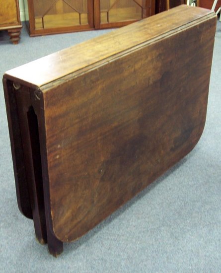 Appraisal: A mahogany two-flap table on square chamfered legs cm wide