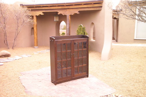 Appraisal: GUSTAV STICKLEY Early two-door bookcase with mitered mullions gallery top