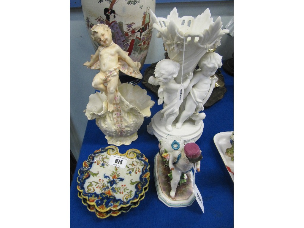 Appraisal: Pair of faience dishes and three cherub decorated centrepieces