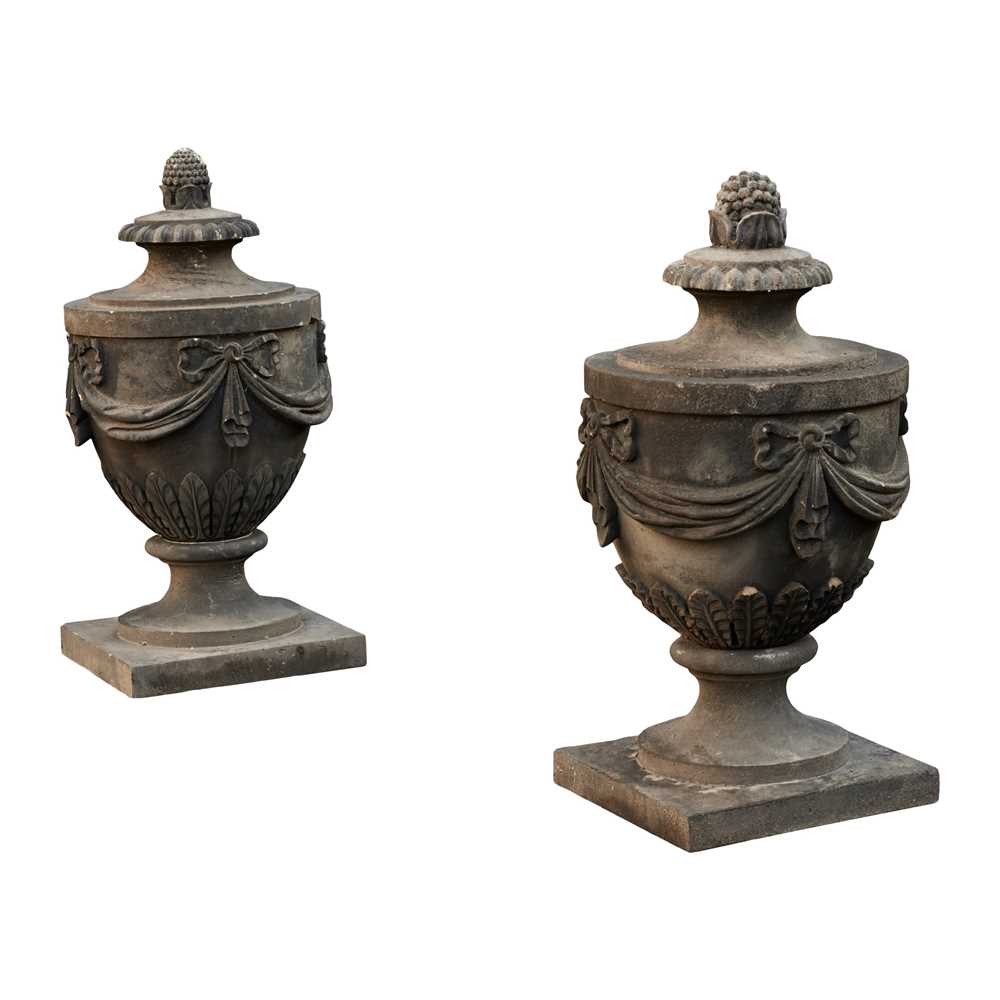 Appraisal: PAIR OF CARVED SANDSTONE ADAM STYLE URNS TH CENTURY the