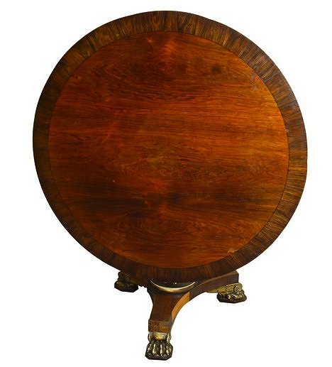 Appraisal: A Regency rosewood circular dining table the top with broad