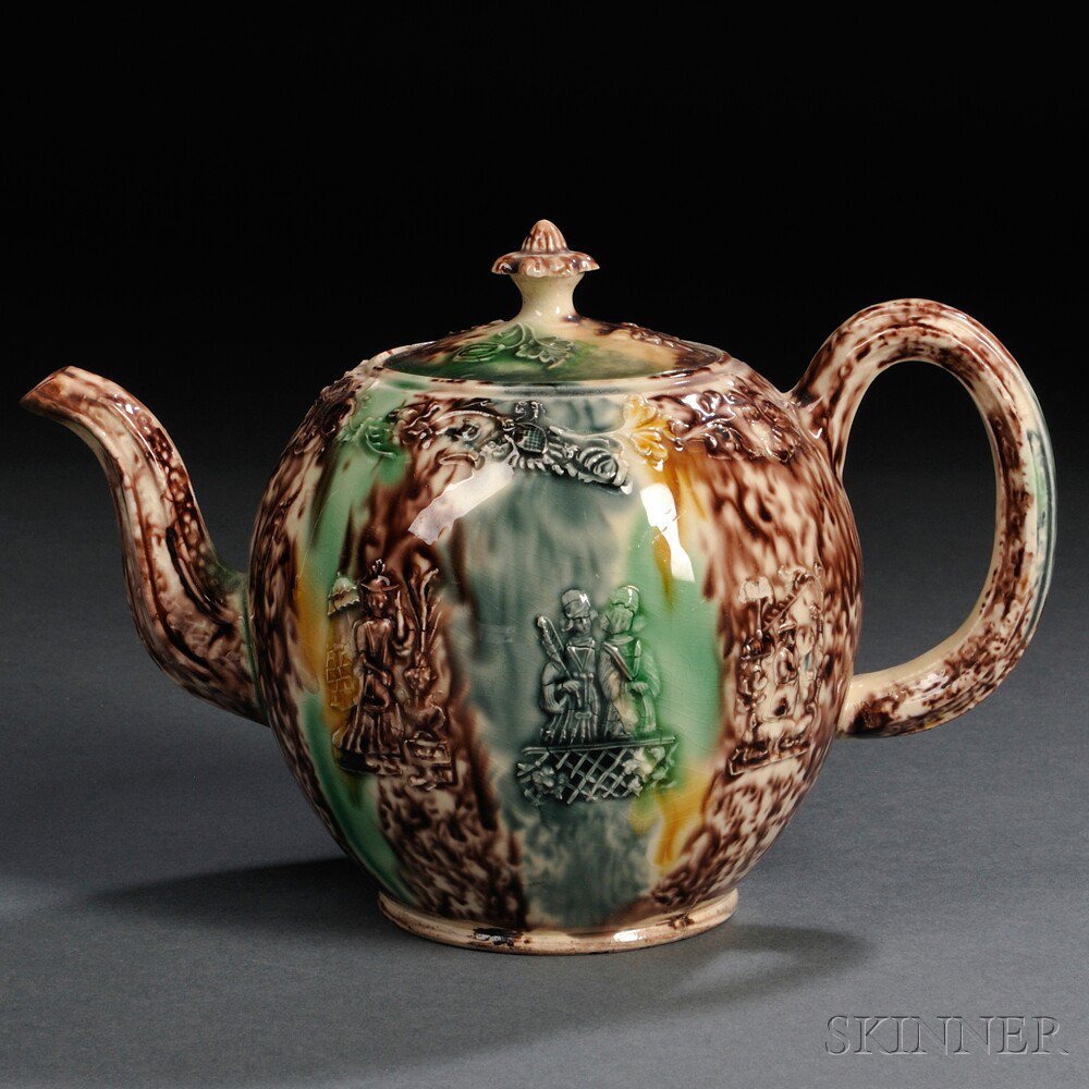 Appraisal: Staffordshire Cream-colored Earthenware Teapot and Cover England c globular shape