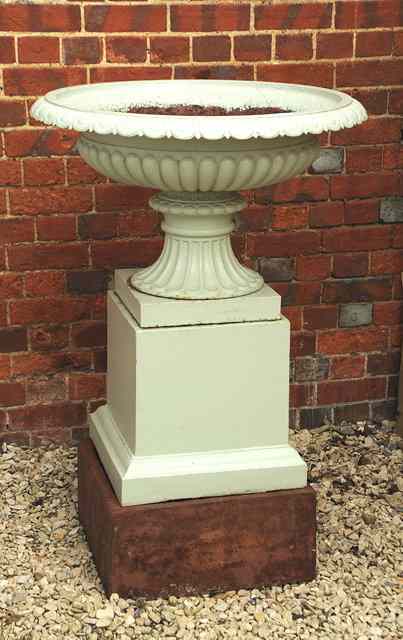 Appraisal: A VICTORIAN PAINTED CAST IRON URN of campana form fluted