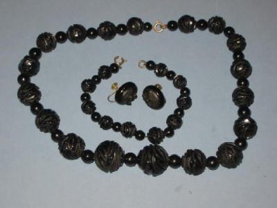 Appraisal: A JET BEAD NECKLACE AND BRACELET the larger circular beads