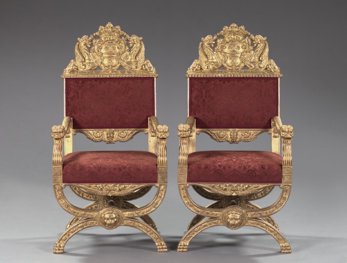 Appraisal: Pair of Baronial-Style Giltwood Armchairs each with a crowned shield-form