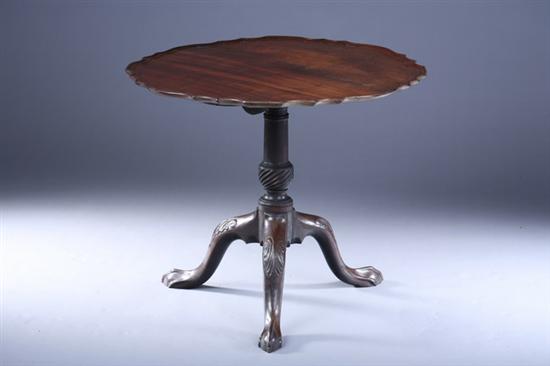 Appraisal: CHIPPENDALE STYLE MIXED WOOD PIECRUST TEA TABLE th Century composed