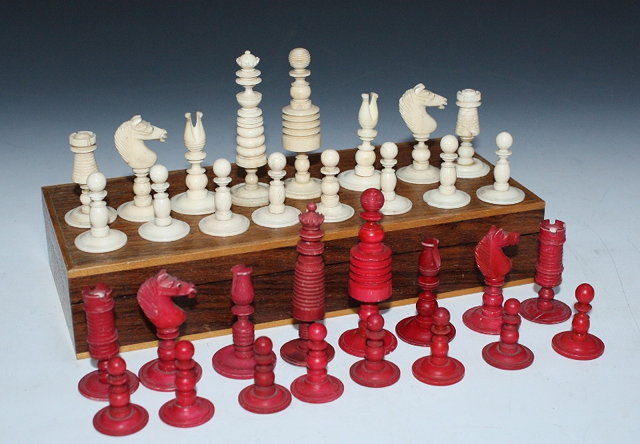 Appraisal: A TURNED AND STAINED BONE CHESS SET cm high