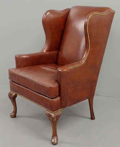 Appraisal: Queen Anne style red leather wing chair h x w