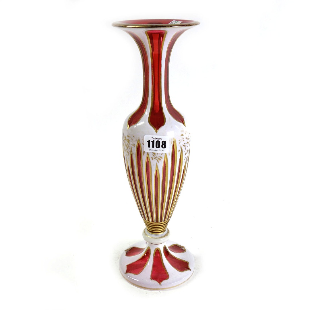 Appraisal: A cranberry and white enamel glass vase late th early