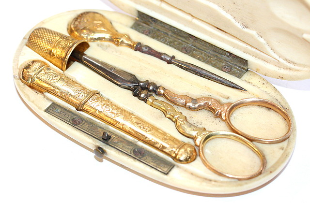 Appraisal: A PALAIS ROYALE IVORY ETUI with gold mounted scissors thimble