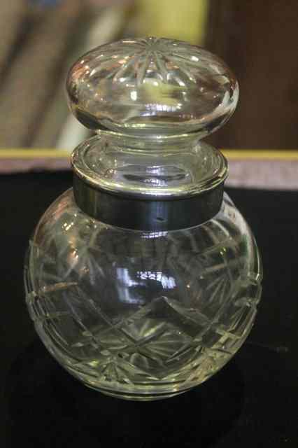 Appraisal: A CUT GLASS JAR of bulbous form with silver mounted