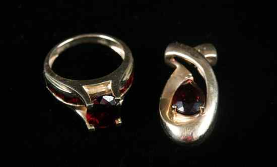 Appraisal: TWO PIECES K YELLOW GOLD AND GARNET JEWELRY Ring with