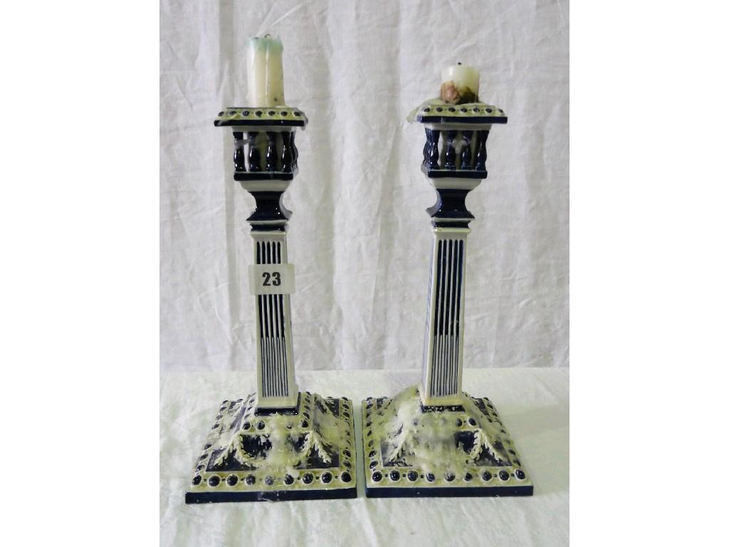 Appraisal: A pair of th century Royal Worcester square cut candlesticks