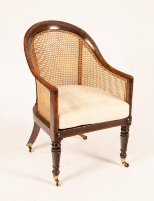 Appraisal: A George IV simulated rosewood berg re the arched caned