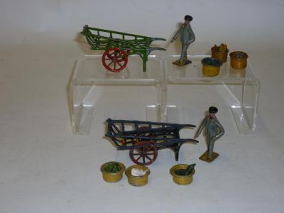 Appraisal: Two Taylor Barratt costermongers with hand carts each with three