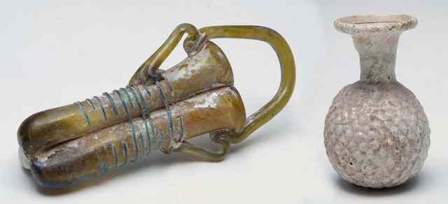 Appraisal: A ROMAN GLASS DOUBLE BALSAMARIUM with carrying handle and applied