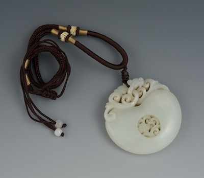 Appraisal: A Chinese Carved White Jade Pendant Grayish white jade pendant