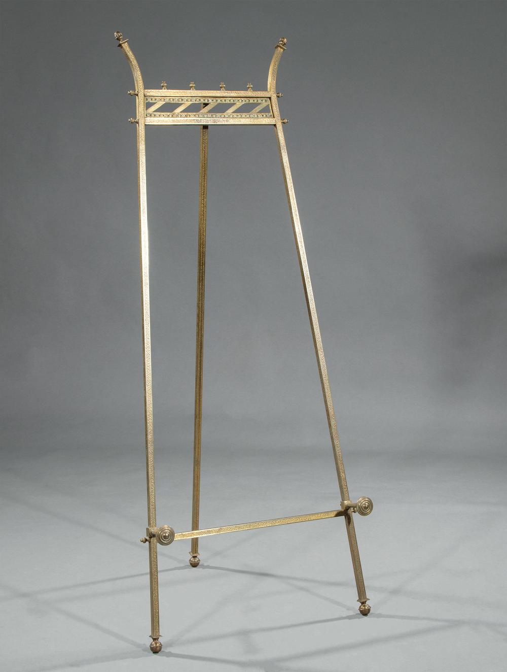 Appraisal: American Aesthetic Brass Easel late th c finialed crest rail