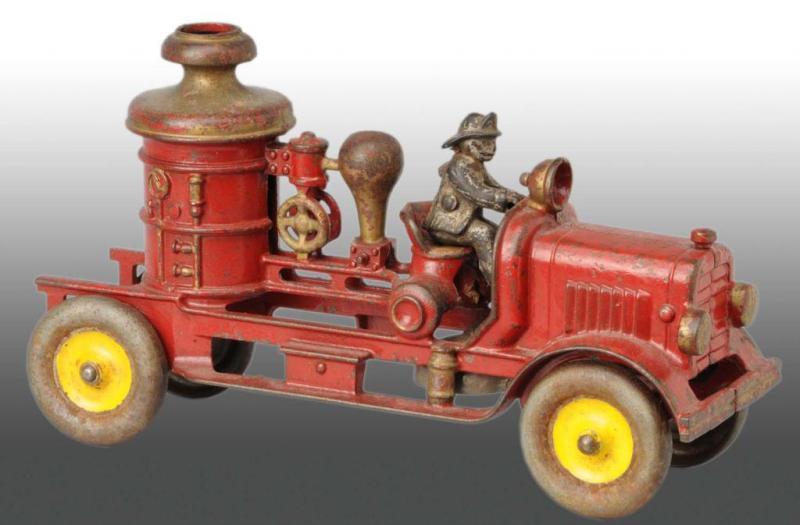 Appraisal: Cast Iron Fire Pumper Toy Description Includes original separate driver