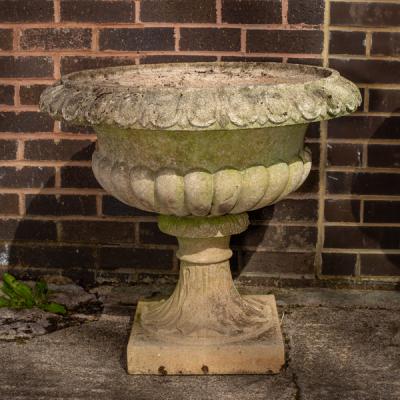 Appraisal: A large reconstituted stone garden vase with reeded base cm